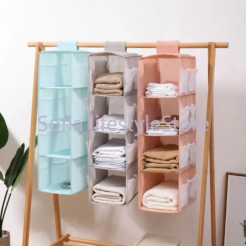 Multi-Layer Hanging Storage Bag Wardrobe Clothes Organizer . Garment organizer